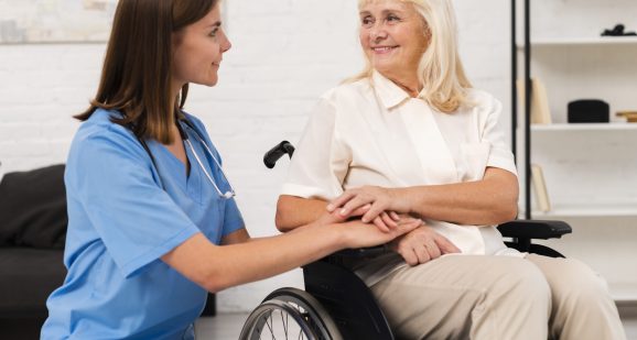 caregiver-taking-care-woman-wheelchair